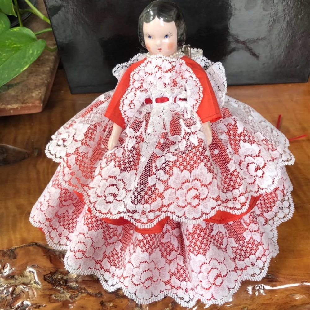 Vintage porcelain doll about 8 “ tall.